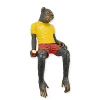 Picture A sculpture of a dressed, sitting monkey made of bronze