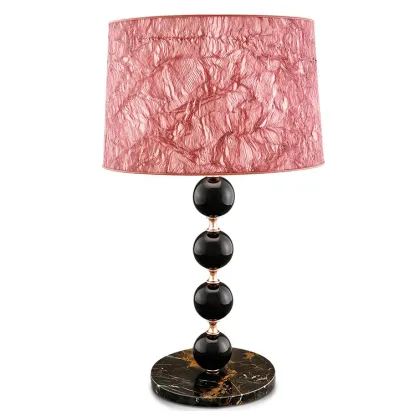 Zdjęcie Oryginalna lampka z ceramiki na marmurowej podstawie