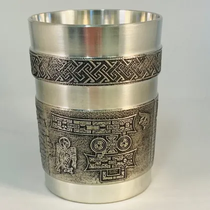 Picture A tin Irish mug with a letter from the Book of Kells