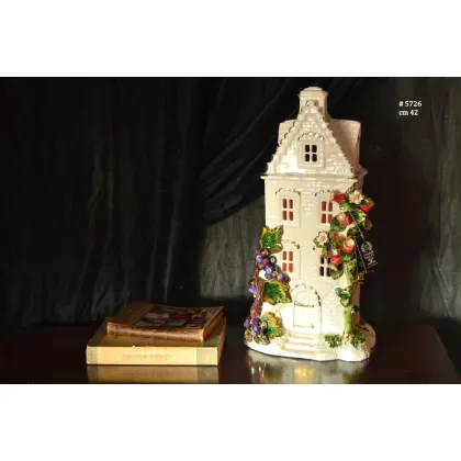 Picture A ceramic decorative figurine depicting a house