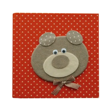 Picture A stylish development journal in the first year of life with a teddy bear