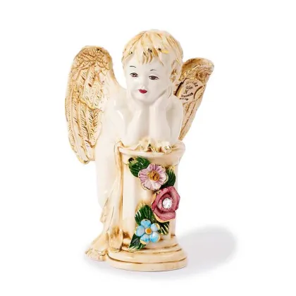 Picture A beautiful figurine of an angel resting on a ceramic base