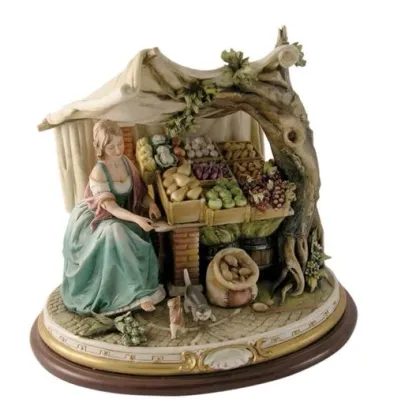 Zdjęcie Kobieta sprzedająca owoce - elegancka włoska porcelana
