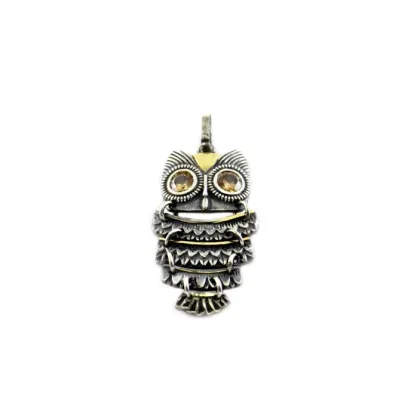 Picture Owl pendant made of silver with gold details and yellow zirconia crystals
