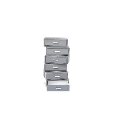 Picture An original chest of drawers in the shape of a stack of suitcases