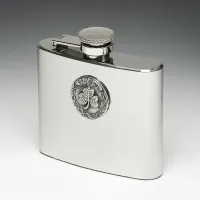 Picture A stainless steel hip flask decorated with a tin disc with a clover