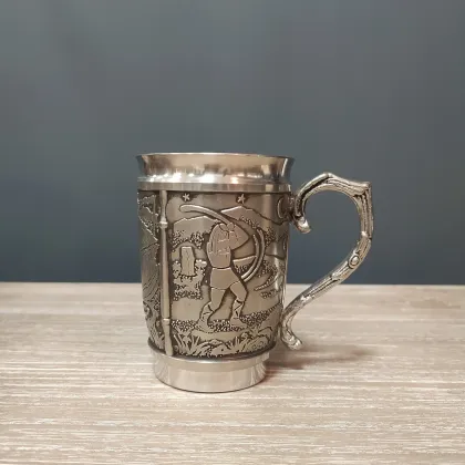 Picture An Irish tin mug depicting the legend of Cuchulainn and Ferdia