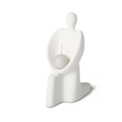 Picture A handmade figurine of an angel with a candle