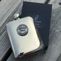 Picture A unique pewter whiskey flask with a decorative inscription