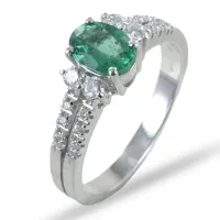 Picture Italian ring with an oval emerald and a double band with diamonds on a shank