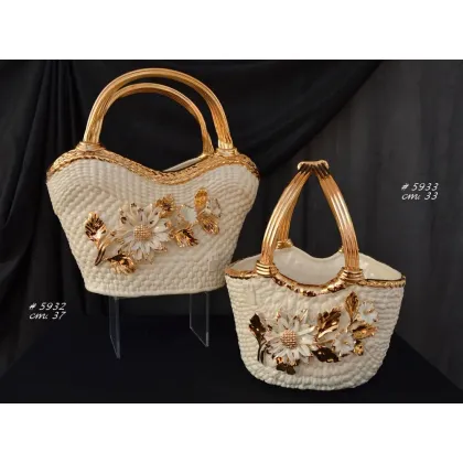 Picture Exclusive ceramics in the form of a decorative bag with gold elements