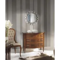 Picture A small, elegant antique walnut-colored chest of drawers with star-shaped inlay