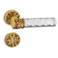 Picture King door handle made of brass and glass for stylish interiors