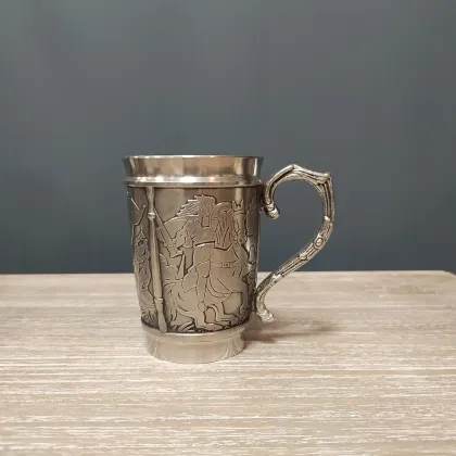 Picture A tin mug depicting a story from Irish mythology about Culainn's dog