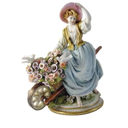 Zdjęcie Piękna dziewczyna z taczką - porcelanowa figurka do salonu