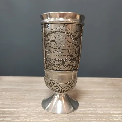 Picture A pewter cup with a depiction of the Irish story about Culainn's dog