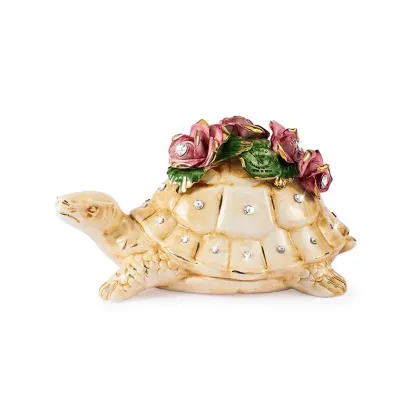Picture A handmade turtle figurine decorated with roses