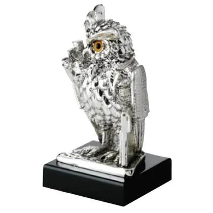 Picture A statuette with an owl on the desk