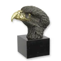 Picture A bronze sculpture depicting an eagle's head on a marble base