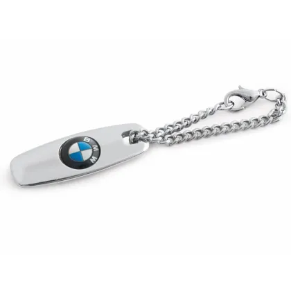 Zdjęcie Wykonany z niklu- brelok z logo firmowym