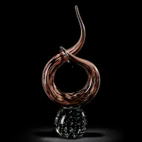 Picture An interesting sculpture depicting an aventurine knot with a crystal base.
