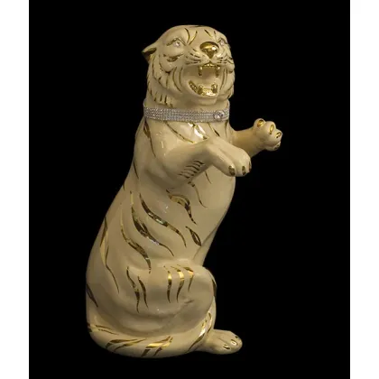 Picture A large ceramic tiger with a decorative collar