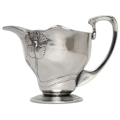 Picture A beautiful milk jug decorated with a flower