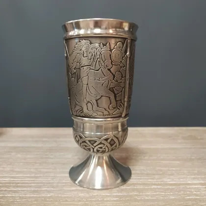 Picture A pewter cup with a depiction of the Irish story of Cuchulainn and Ferdia