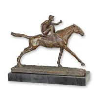 Picture Sculpture of a jockey on a horse made of bronze with a marble base