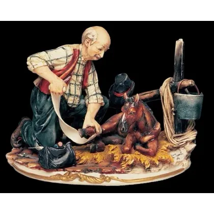 Zdjęcie Piękna porcelanowa figurka weterynarza