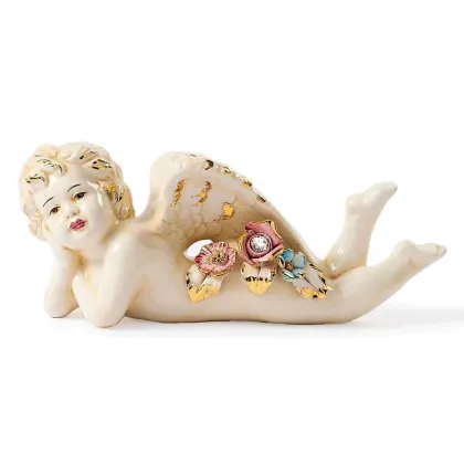 Picture Decorative figurine of a lying angel made of ceramics