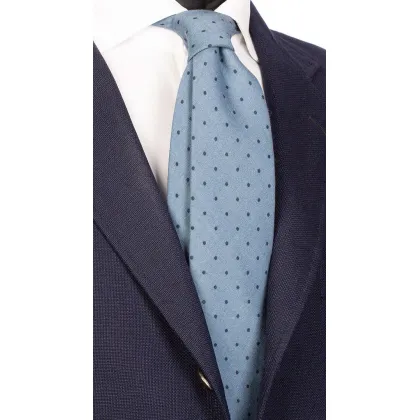 Picture A delicate, blue tie with black dots made of wool