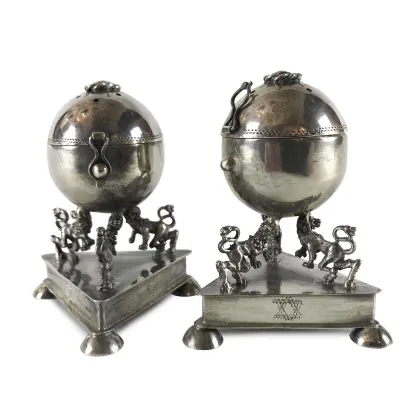 Picture A pair of round silver besaminas with a triangular base from the 20th century