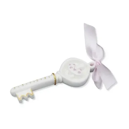 Picture A unique sculpture - a key of fortune with a pink ribbon