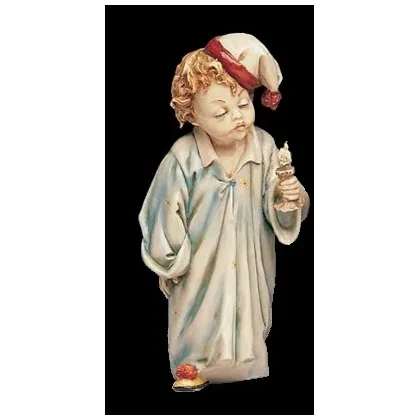 Zdjęcie Porcelanowy chłopczyk ze świecą