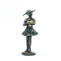 Picture A charming figurine of a girl holding a heart - a gift for various occasions