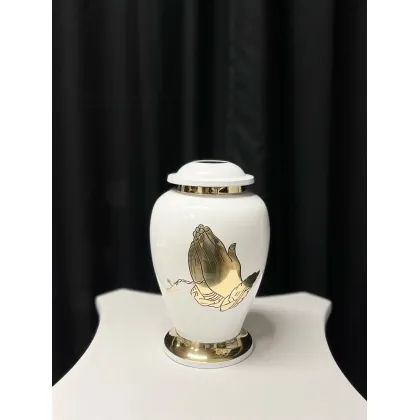 Picture A unique white and gold funeral urn