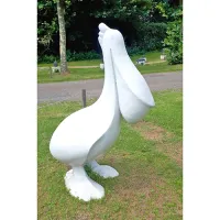 Picture Luxurious sculpture of a white pelican as a garden decoration