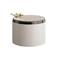 Picture Stylish leather box Ø15xH10 cm in pearl color decorated with a gold dolphin