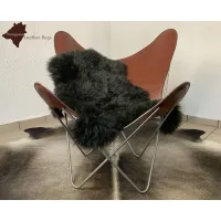 Picture Stylish black sheepskin rug for the living room or bedroom