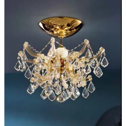 Zdjęcie Żyrandol Mariateresa z pozłacaną metalową ramą pokrytą szklanymi ramionami i przezroczystymi kryształowymi zawieszkami - Il Paralume Marina