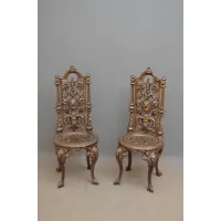 Picture A very decorative pair of antique cast iron chairs with high backs
