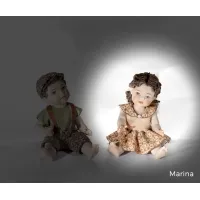 Picture Porcelain sitting girl doll - Sibania