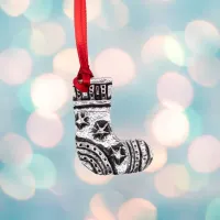 Picture A small tin Christmas ornament in the shape of a stocking