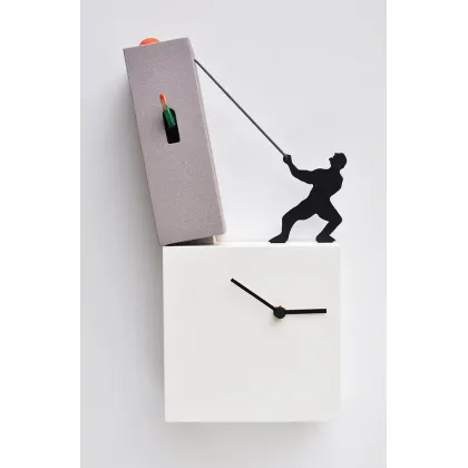 Picture A decorative wall or desk clock with a cuckoo