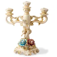 Picture Elegant ceramic candlestick with roses and a cherub