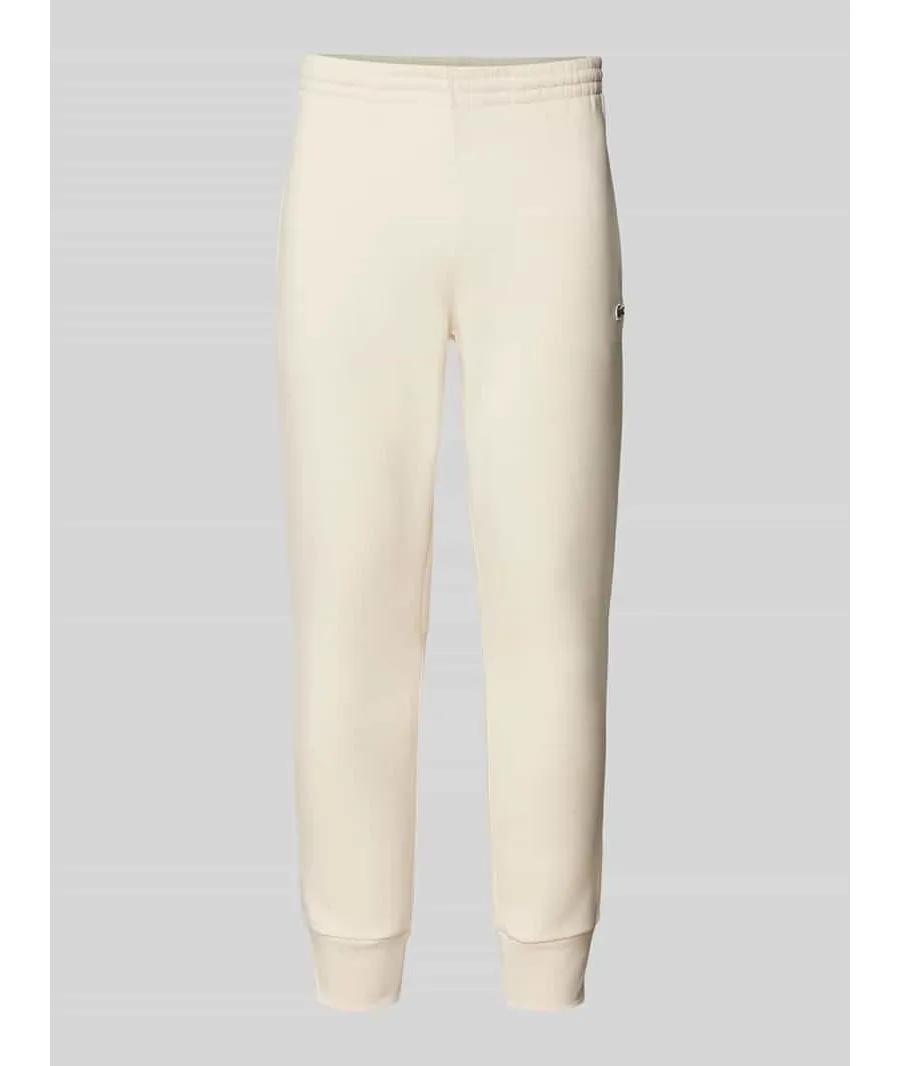 obrazek 1 Spodnie dresowe o kroju slim fit z naszywką z logo