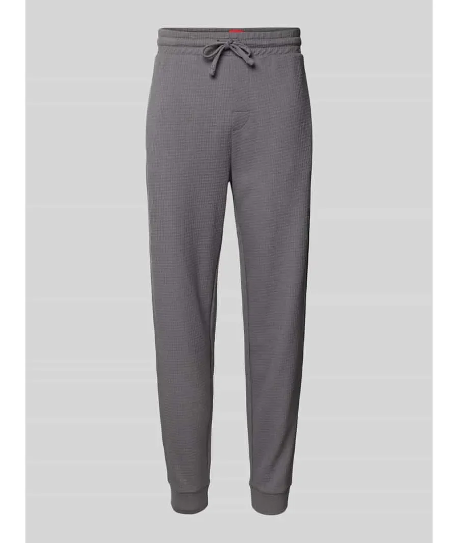 obrazek 1 Spodnie dresowe o kroju relaxed fit z fakturowanym wzorem model ‘Austin’