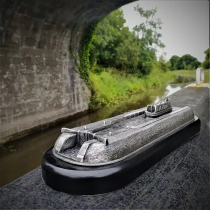 Picture A unique sculpture of a river barge made of pewter