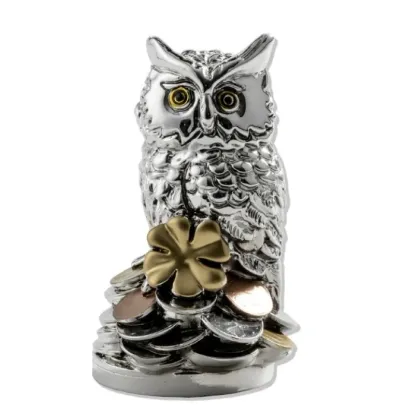 Picture A unique silver lucky amulet in the shape of an owl with a clover